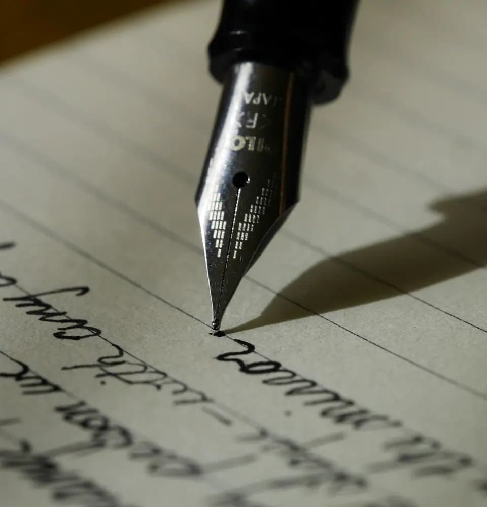 Fountain pen writing on paper representing content marketing services