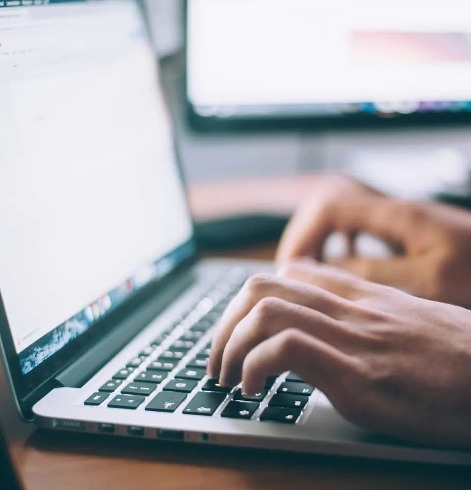 Hands typing on a laptop representing digital PR for SEO
