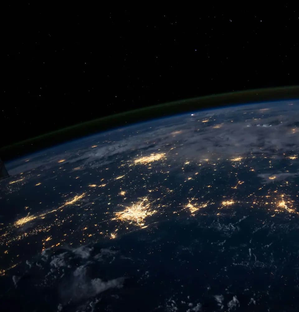 Earth at night with connected city lights representing high authority link building services