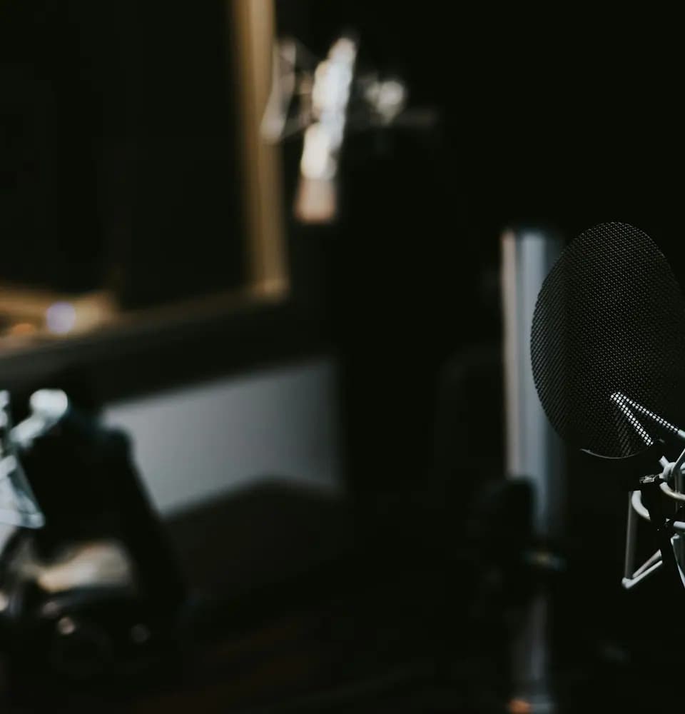 Podcast microphone in a recording studio representing podcast and interview placements